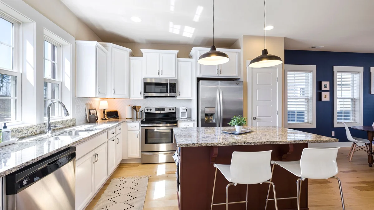 Kitchen with quartz island and bar seating