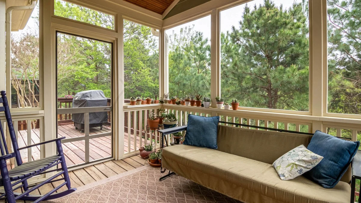 Screened porch with rocking chair